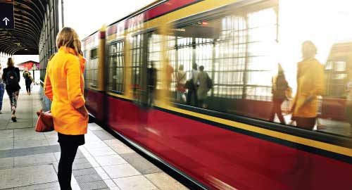 Person waiting at commuter train stop.