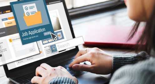 Person on laptop subsmitting a job application.