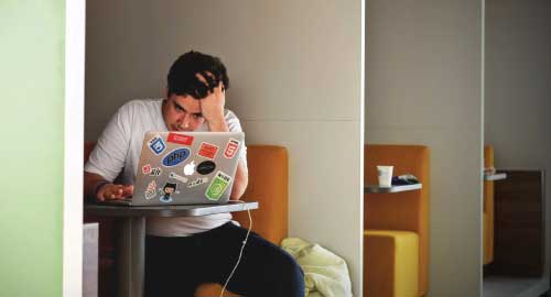 Person sitting at computer.