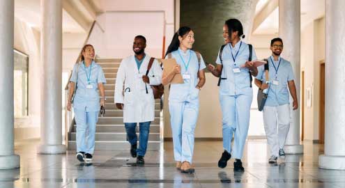 Medical professionals walking and talking.